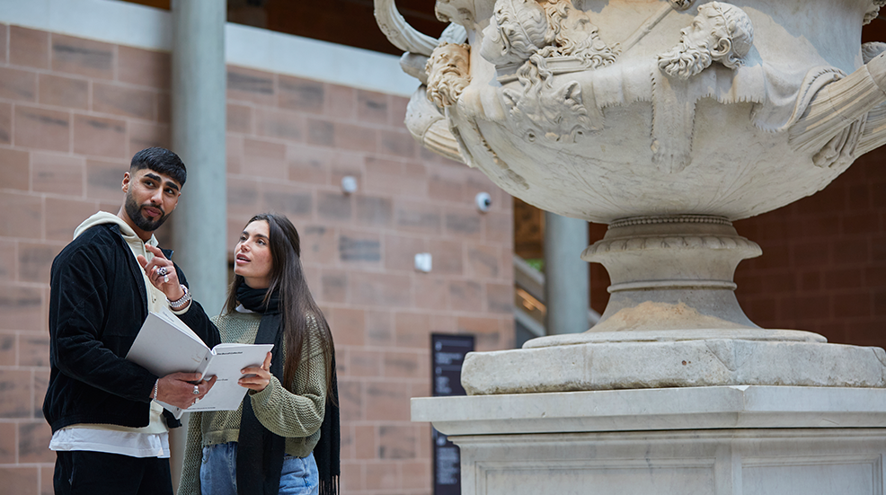 Young couple looking captivated by the Burrell Collection